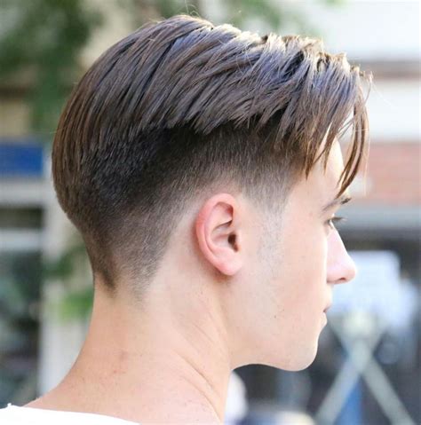 To make things easier for you, consider complementing your center parted hairstyle with a fade. . Low fade middle part
